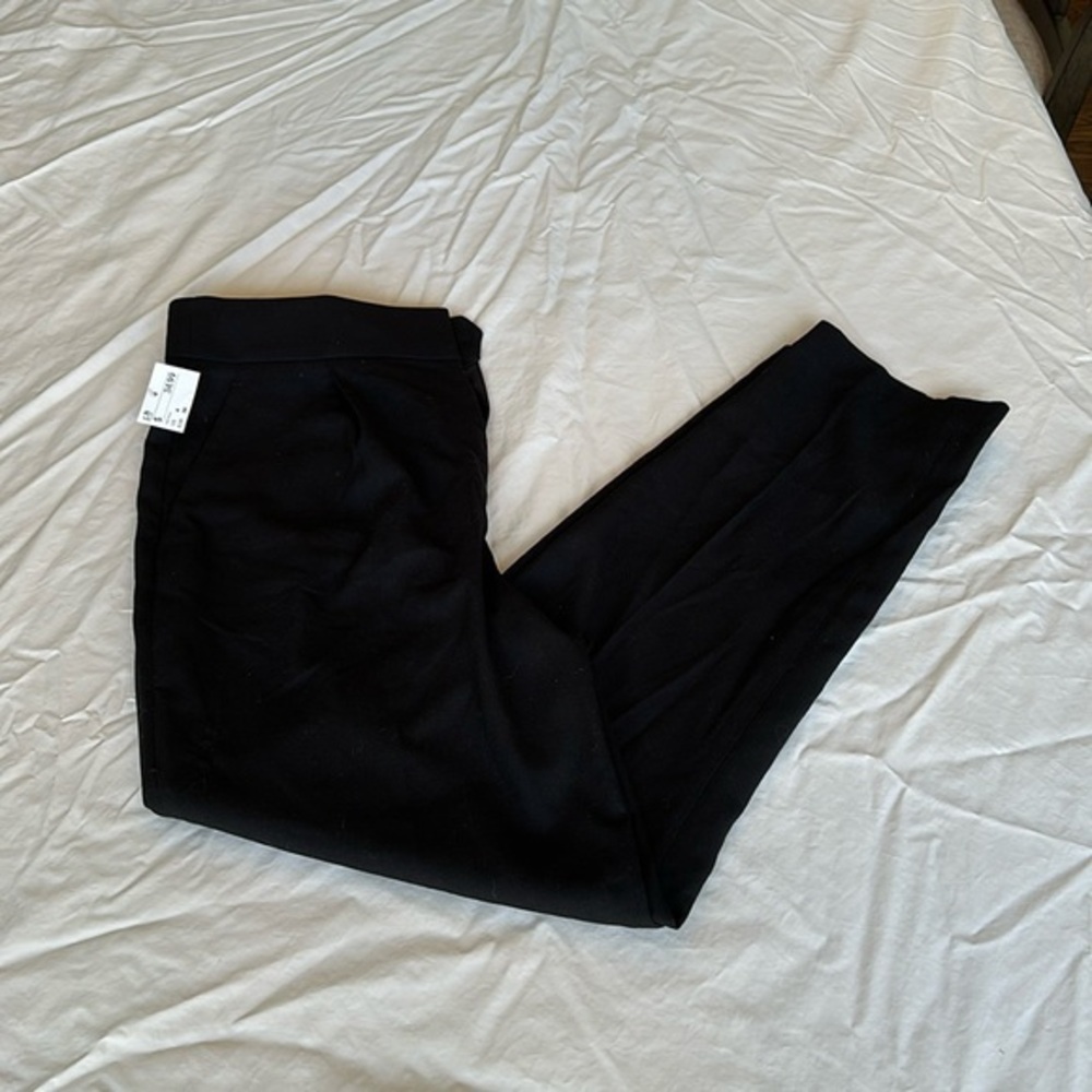 NEW WITH TAGS! H&M black dress pants. Lightweight material with button and clasp
